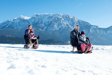 rodelspass familie winter Kufsteinerland